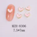 Close-up detail of pink enamel heart nail art charms with gold metal borders 7.5x7mm - 8306 Gold Border Pinkish White (7.5x7mm)