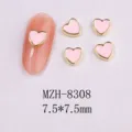 Macro view of pink enamel heart nail art charms with gold edges, size 7.5x7.5mm details - 8308 Gold Border Pink Pearl (7.5x7.5mm)