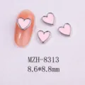 Detailed view of pink heart nail charms with silver metal border and 8.8mm size - 8313 Gold Border Purple Shell (8.6x8.8mm)