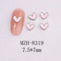 Close-up of pink enamel heart nail charms with silver metal edging on white background - 8319 Silver Border White Shell (7.5x7mm)