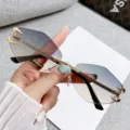 Chic rimless gradient polygon sunglasses with metal claw decor, trendy fashion eyewear. - Rimless Polygon / Gold Frame Grey Tea Lens