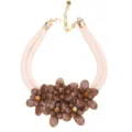 Close-up view of a double-layer necklace with brown acrylic flowers and a white cord - Necklace