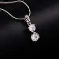 Detailed view of a silver double-stone pendant necklace showcasing polished sparkle. - Double Round Zirconia Style (DZ10357)