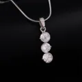 Close-up detail of the triple cubic zirconia pendant necklace showing fine sparkle. - Triple Round Zirconia Style (DZ10342)