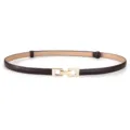 Close up view of the thin dark brown leather belt with elegant gold interlocking metal buckle. - Coffee