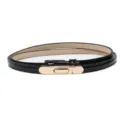 Sleek black patent leather belt for women featuring a stylish gold metal clasp accessory. - Glossy Black