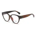 Retro tortoise cat-eye glasses detail close-up showcasing the chic heart temple accent. - Anti blue light / Leopard Print
