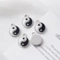 Detailed macro shot of Yin Yang Taiji charms with black white enamel and crystals for DIY - Tai Chi Yin Yang Rhinestone / 15.5mm*12mm / Silver (with Zirconia)