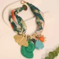 Detail of Bohemian scarf necklace with gold butterfly and green conch charms - Dark Green (X-890)