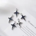 Detailed view of silver-plated black enamel star-shaped pendants for DIY jewelry. - Hollow Star / 21.5mm*14.5mm / Silver (Black Enamel)