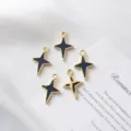 Detailed macro view of four-pointed star jewelry charms with gold plating and black enamel. - Hollow Star / 21.5mm*14.5mm / Gold (Black Enamel)