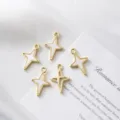 Close-up detail of five gold-plated four-pointed star charms with white enamel for DIY jewelry - Hollow Star / 21.5mm*14.5mm / Gold Color (White Enamel)