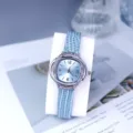 Elegant women quartz watch with light blue leather strap and shiny rhinestone bezel design. - Sky Blue