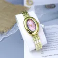 Gold oval women's watch with pink dial and metal strap, unique vintage fashion wristwatch. - Pink
