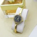 Women's gold bangle quartz watch with rhinestone bezel, black dial and elegant style fashion reloj. - Black