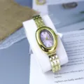 Elegant oval vintage women gold watch with purple dial and stylish steel strap accessory. - Purple