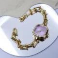 Chic square dial bracelet watch in gold with elegant purple face and stylish U-link design. - Purple