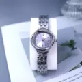 Women's quartz watch with crystal swirl bezel, silver metal strap and purple dial for daily wear. - Purple