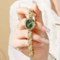 Élégante montre quartz rétro pour femme avec cadran vert oval et bracelet chaîne doré fin. - Or Vert
