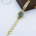 Reloj de cuarzo ovalado vintage con bisel de estrás y pulsera de metal dorado para mujer. - Verde