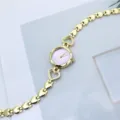 Goldene Herz-Armbanduhr für Damen mit lila Pony-Zifferblatt Detailansicht des Produkts. - Lila