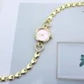 Goldene Herz Glieder Damen Quarz Uhr mit süßem Pony Zifferblatt Mode Studenten Armbanduhr - Rosa