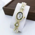 Elegant women's quartz watch with stylish pearl bracelet, luxury gold finish, ideal for daily wear. - White