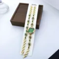 Damen Quarz Mode Armbanduhr Set mit grünen Strasssteinen und goldem Ketten Design. - Grün