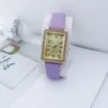 Elegante dames quartz horloge met paarse lederen band en gouden rechthoekige strass kast. - Paars