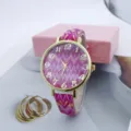 Stylish women's quartz watch featuring a pink wave pattern dial and a gold-tone bezel for casual wear. - Rose Red