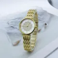 Elegante reloj de mujer dorado con esfera de diamantes de imitación, números romanos y correa. - Blanco