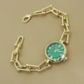 Elégante montre bracelet femme dorée à maillons avec cadran vert quartz chic. - Vert