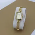 Gold tone rectangular quartz watch for women, delicate hollow bracelet strap, chic casual style. - Gold
