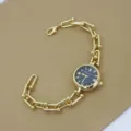 Montre bracelet chaîne dorée élégante pour femme avec cadran noir mode quartz chic - Noir