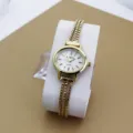 Elegante goldene Quarz Damenarmbanduhr mit filigranem Mehrfach-Kettenarmband und weißem Zifferblatt. - Gold Weiß