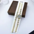 Damen Quarz Modeuhr Armband Set mit Strass Herz Details und goldener Metalloberfläche. - Schwarz