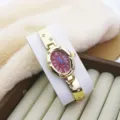 Elegant oval women bracelet quartz watch with Roman numerals and dazzling rhinestone accents. - Gold Red