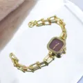 Chic gold-tone chain quartz watch with a square crystal bezel and vintage bracelet design. - Red