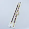 Set orologio al quarzo donna e bracciale cristallo viola con finitura oro elegante e pietre. - Viola