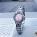 Women quartz watch with pink dial rhinestone bezel and wave metal strap fashion daily wear. - Silver Pink
