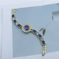 Women's fashion quartz bracelet watch with blue square stones and shiny rhinestones gold tone - Blue