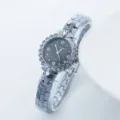Montre quartz femme élégante avec lunette en strass étincelants et beau bracelet métallique. - Noir Argenté