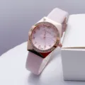Women's quartz wristwatch with pink PU leather strap, rose gold crystal bezel and textured dial. - Pink