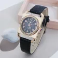 Square quartz watch detail, gold rhinestone case and black leather strap for women. - Black