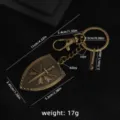 Vintage bronze alloy shield sword keychain with clear dimension specs for daily bags and keys. - Shield 2 (X1769) / Bag Packaging