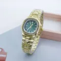 Detailed shot of the gold-tone women's square wristwatch featuring a green dial and rhinestone bezel. - Gold Green