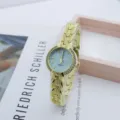 Elegant women quartz watch with crystal bezel and gold leaf bracelet fashion timepiece. - Lake Blue