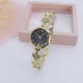 Elegante dames quartz horloge met klaverblad armband, gouden metalen afwerking en zwarte wijzerplaat. - Goud Zwart
