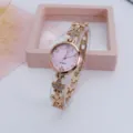Elegant womens rose gold quartz watch with pink dial and rhinestone clover strap design. - Rose Gold Purple