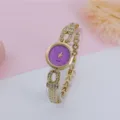 Women fashion rhinestone quartz bracelet watch with purple glitter dial and gold strap detail. - Gold Purple